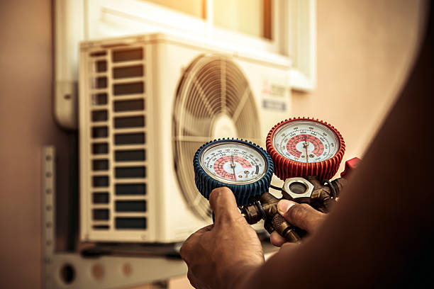 Professional Air Conditioning Service technician working in Anniston, AL